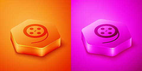 Isometric Film reel icon isolated on orange and pink background. Hexagon button. Vector