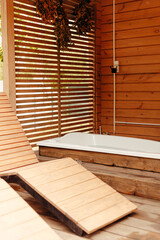 Fototapeta na wymiar Wood spa hammock and bathtub outdoor house, recreation relax zone