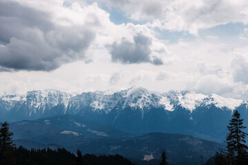 view over snowy mountains on cold winter day.