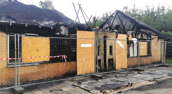 Damaged Danish house after an accidental fire burned down the home