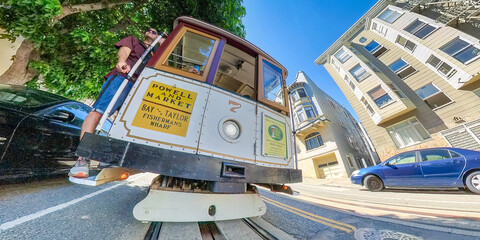 A real Men ride with the San Francisco cable car during summer vacation