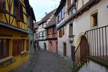 Fototapeta na wymiar Quintessential Alsatian half-timbered buildings in medieval villages in Alsace, France, Europe