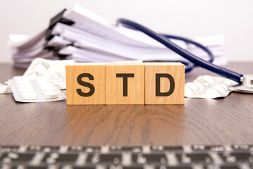 STD Sexually Transmitted Infections text on wooden blocks. medical concept.