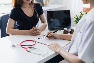 Doctor are giving advice on treatment to patients in hospital examination rooms, treating medicine diseases from specialists. Concepts of medical treatment and health consultation.