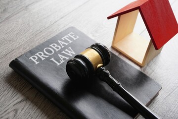 Toy house, gavel and text PROBATE LAW. Real estate and law concept