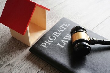 Toy house, gavel and text PROBATE LAW. Real estate and law concept