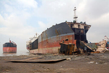 Fototapeta na wymiar Inside of Ship breaking yard chittagong,Bangldesh. Without safety equipment, workers are at risk.