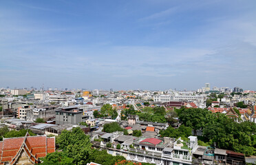 Fototapeta na wymiar BANGKOK, THAILAND - July 22, 2023 : Landscape View of Bangkok City and Thai Buddhist Temple with Blue sky with white cloud. Clear day and good weather in the morning.