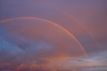 Double rainbow occur on sky in early morning with cloud and multicolor look beautiful and express bright future concept