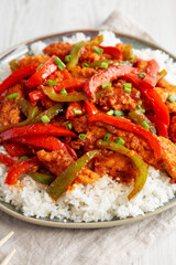 Homemade Simple Chili Chicken with White Rice on a Plate, side view.