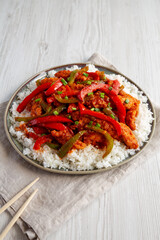 Homemade Simple Chili Chicken with White Rice on a Plate, side view.