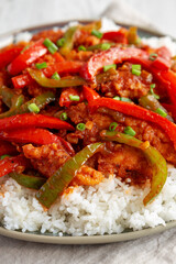 Homemade Simple Chili Chicken with White Rice on a Plate, side view. Close-up.