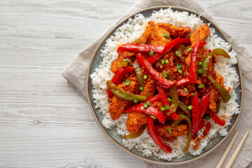 Homemade Simple Chili Chicken with White Rice on a Plate, top view. Copy space.