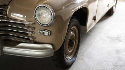 Headlight and hood of a Soviet restored retro car. Close-up