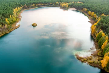 Foto auf Acrylglas Reflection Aerial view of beautiful green waters of lake Gela. Birds eye view of scenic emerald lake surrounded by pine forests. Clouds reflecting in Gela lake, near Vilnius, Lithuania.