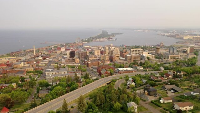 Downtown Duluth, Minnesota, with historic landmarks, modern skyline, lively streets, and scenic waterfront. Aerial view