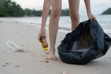 Save water. Volunteer pick up trash garbage at the beach and plastic bottles are difficult decompose prevent harm aquatic life. Earth, Environment, Greening planet, reduce global warming, Save world.