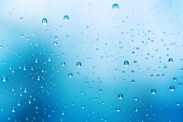 Raindrops on glass. Blue, light background. AI generation
