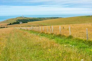 Belle Tout Lighthouse in the distance at Beachy Head near Eastbourne, East Sussex, England 