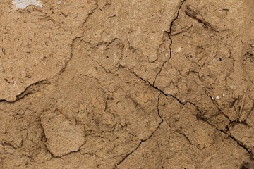 Texture of old clay wall with cracks
