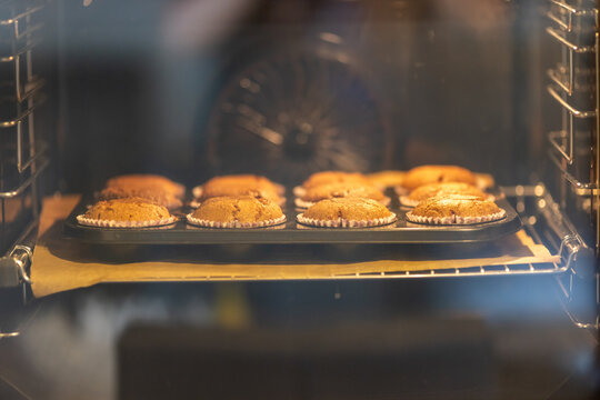 Group of cupcakes inside the oven. Concept of sweets.