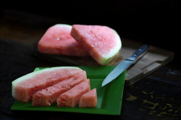 Fresh and Juicy Watermelon in Slices and Cubes on Black