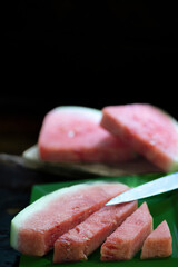 Fresh and Juicy Watermelon in Slices and Cubes on Black