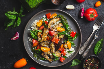 Warm eggplant, pepper, tomato and basil salad