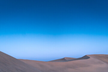 Fototapeta na wymiar Beautiful landscape of the dunes of Maspalomas with a clear sky. Gran Canaria