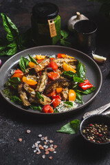 Warm eggplant, pepper, tomato and basil salad
