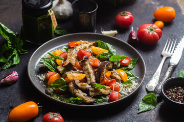 Warm eggplant, pepper, tomato and basil salad