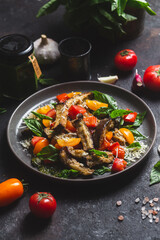 Warm eggplant, pepper, tomato and basil salad