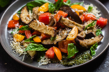 Warm eggplant, pepper, tomato and basil salad