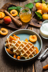 Cottage cheese wafers with apricots and honey in a bowl