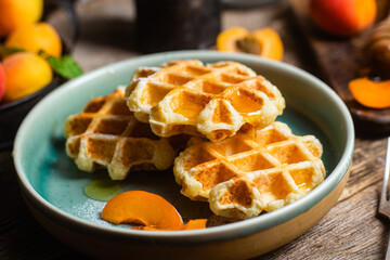 Cottage cheese wafers with apricots and honey in a bowl