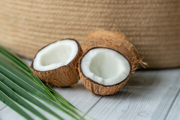 Fototapeta na wymiar Coconut advertising poster image, fresh coconut with palm leaf 