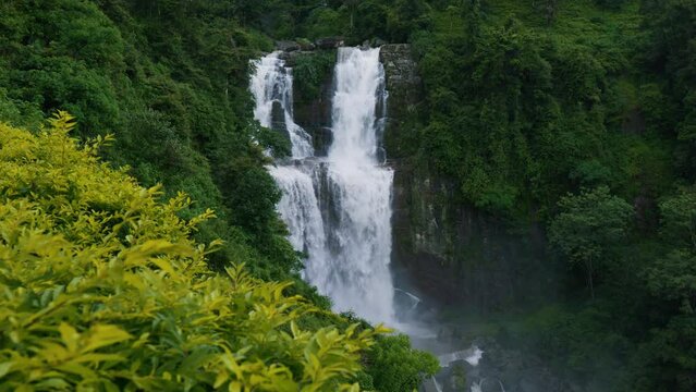 Ramboda Falls. Sri Lanka. Powerful stream of water in rocky mountains.