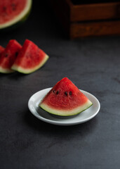 Fresh fruits image, sliced watermelon on white plate 