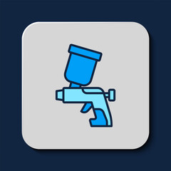 Filled outline Paint spray gun icon isolated on blue background. Vector