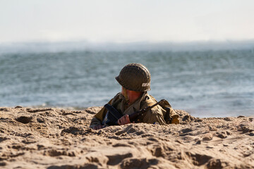 Historical reconstruction. An American infantry soldier from the World War II  fighting on the...