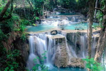 Beautiful nature Huai Mae Khamin waterfall in summer season, cataract falls in green rainforest, the large natural water resources in tropical jungle of Kanchanaburi province, Thailand.