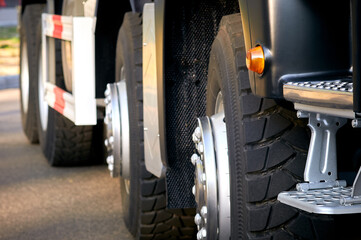 Truck wheels with a step for the driver. The concept of logistics and transportation of goods. Export and import.