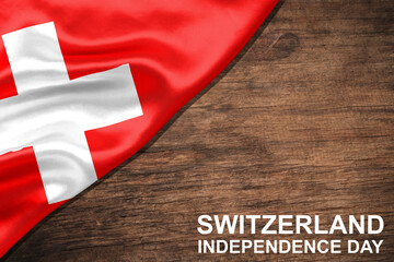Switzerland flag Celebrating Independence Day. Abstract waving flag on wood background.
