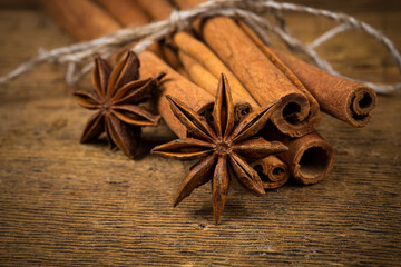 Close up of cinnamon sticks and star anise on wood