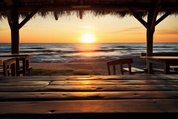 Beautiful sunset on the beach with table and chair, Thailand