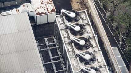 Cooling towers in data center building. Air conditioning cooling towers in front of building with...