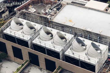Cooling towers in data center building. Air conditioning cooling towers in front of building with...