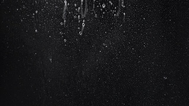 Foam running on black with light spray mist for window cleaning  or beverages 