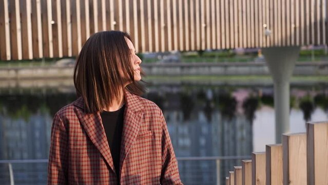 Young attractive Latina model girl walking around the city. The pier in the background.