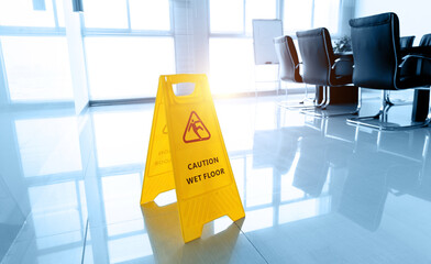 Wet floor caution sign in meeting room